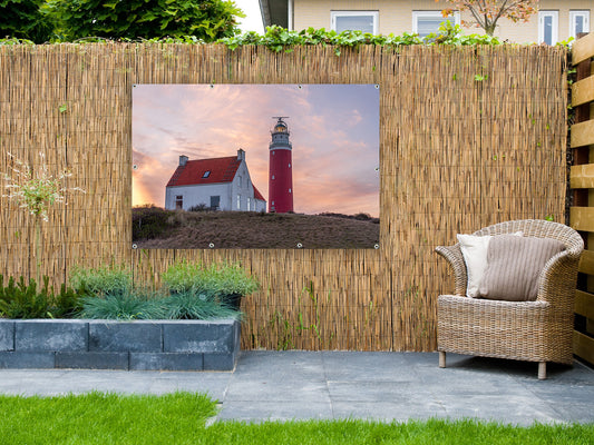 Gartenposter Häuser bei dem Leuchtturm von Texel